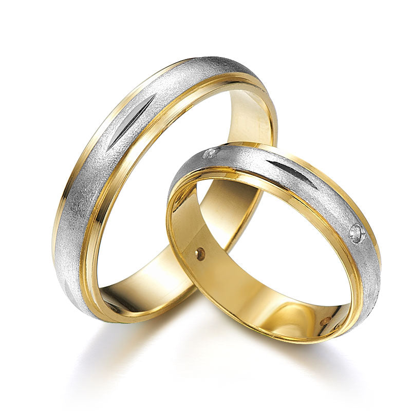 Two-tone wedding rings decorated with diamonds