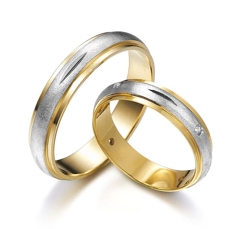 Two-tone wedding rings decorated with diamonds
