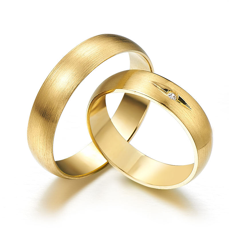 Subtle yellow gold wedding rings with diamonds