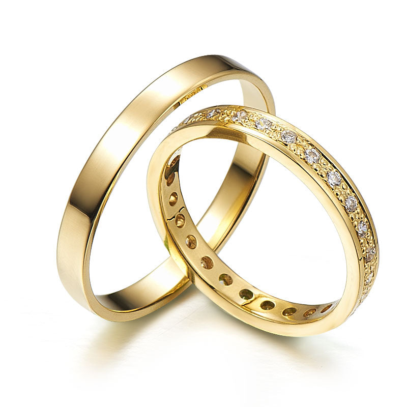 Gorgeous yellow gold wedding rings adorned with diamonds