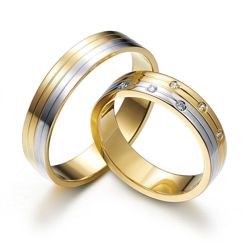 Wedding rings decorated with longitudinal cuts and six diamonds
