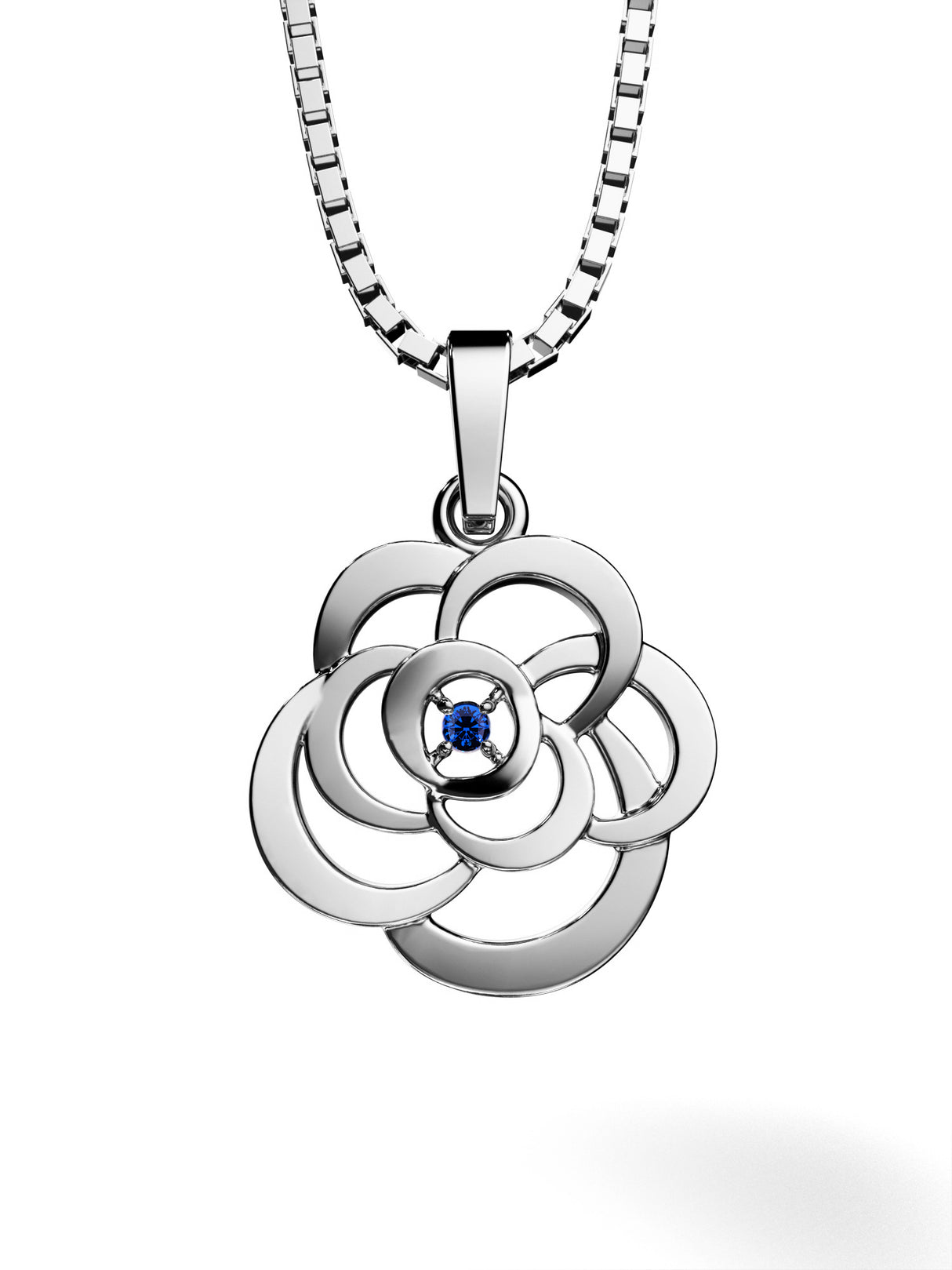 A beautiful silver pendant with a natural sapphire