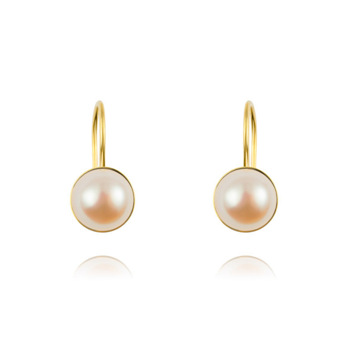 A subtle duo of gold earrings with pearls
