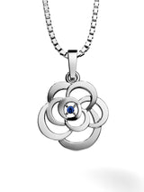 A beautiful silver pendant with a natural sapphire