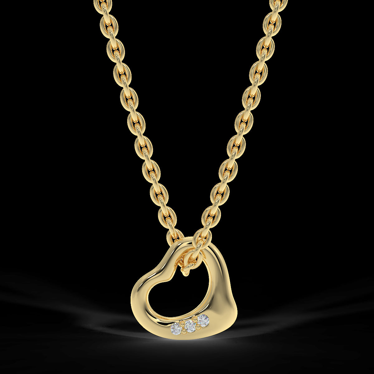 Yellow gold heart pendant with three diamonds