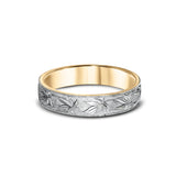 A wedding ring decorated with maple leaves